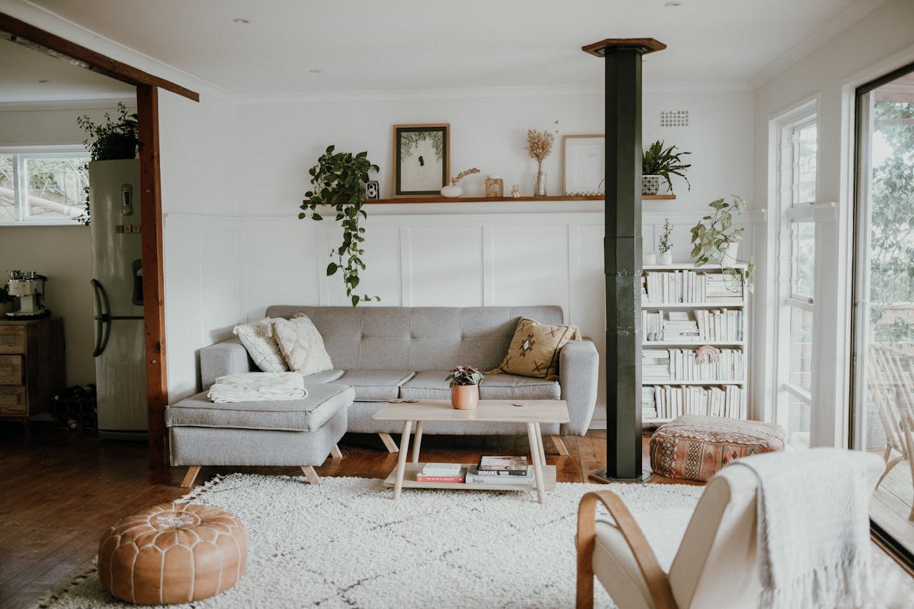 Bright and airy Scandinavian design living room with elegant decor and lush greenery.